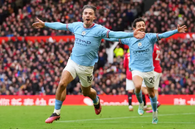 Jack Grealish celebrates scoring for Man City against Man Utd.