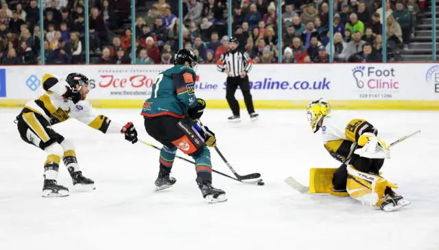 David Gilbert in action against Nottingham Panthers Mike Hammond and Alex Dubeau during Saturdays Elite Ice Hockey League in Belfast.