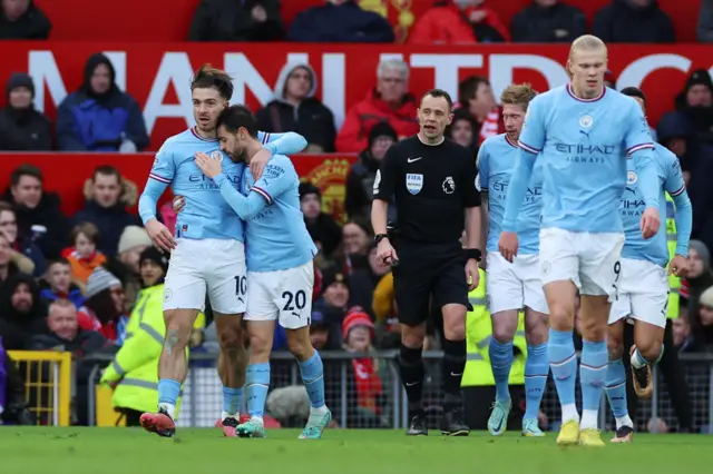 Jack Grealish celebrates with team-mates after putting Man City ahead.