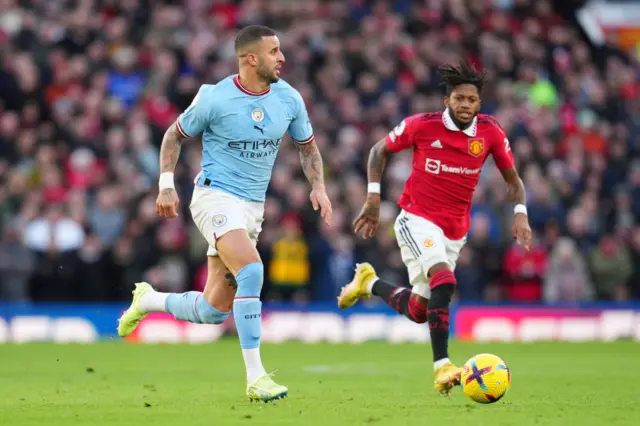 Man City's Kyle Walker dribbles the ball down the wing.