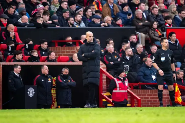 Man City boss Pep Guardiola looks on at Old Trafford.