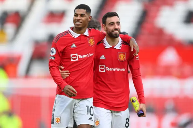 Bruno Fernandes and Marcus Rashford celebrate Man Utd's derby win.