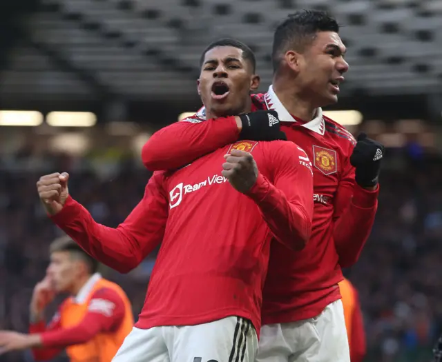 Marcus Rashford celebrates scoring for Man Utd versus Man City.