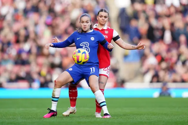 Guro Reiten of Chelsea is closed down by an Arsenal defender.