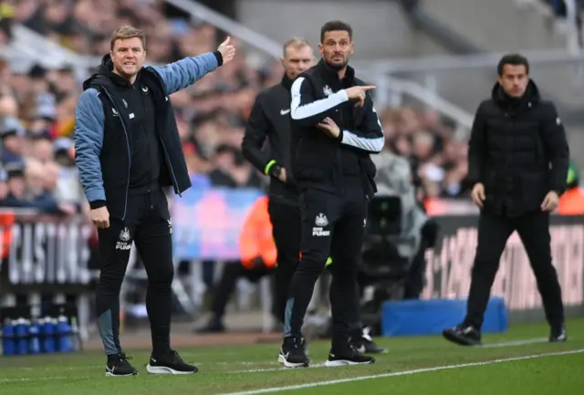 Both managers watch on from the sidelines.