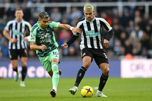 Newcastle's Bruno Guimaraes evades a challenge in midfield.