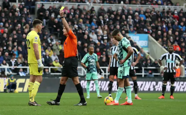 Newcastle keeper Nick Pope is booked.