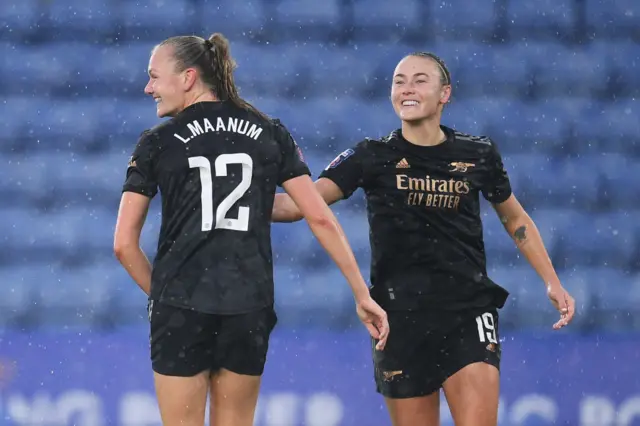 Caitlin Foord and Frida Maanum celebrate after Arsenal score against Leicester.