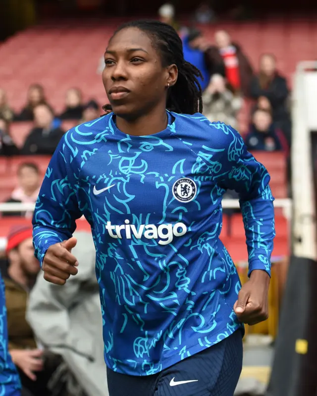 Chelsea defender Kadeisha Buchanan goes out to warm up.