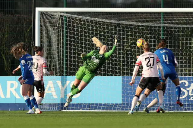 Deanna Cooper heads in a second goal for Reading at Everton.