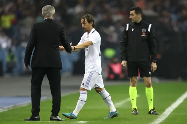 Luka Modric leaves the field of play.