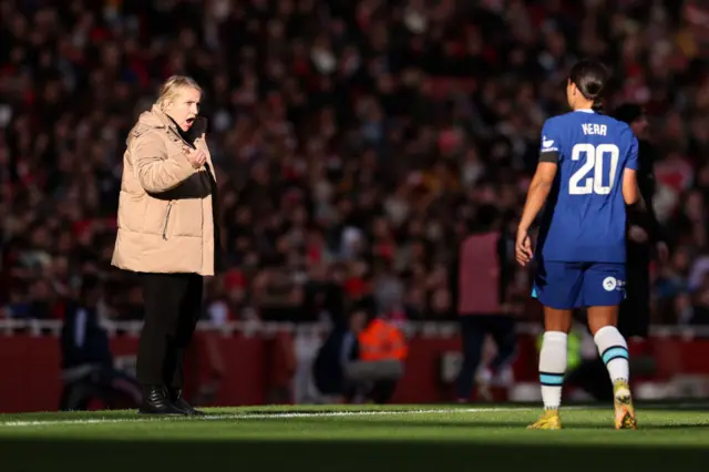 Chelsea boss Emma Hayes speaks to forward Sam Kerr.