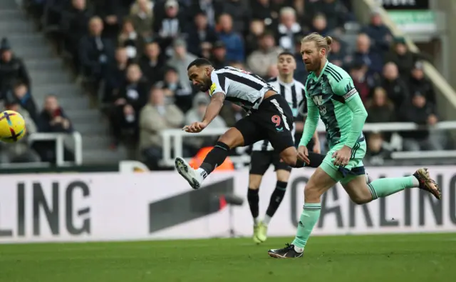 Newcastle forward Callum Wilson takes aim at goal.