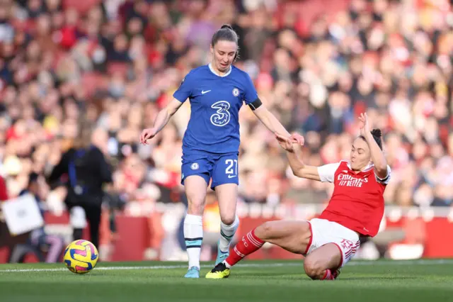 Caitlin Foord of Arsenal challenges Chelsea's Niamh Charles.