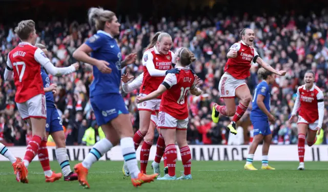 Arsenal captain Kim Little celebrates after scoring the opening goal.