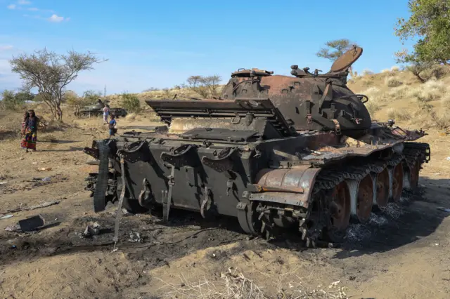 Tanks destroyed during combat sit by the side of the road on December 30, 2021 in Darsageta, Ethiopia.