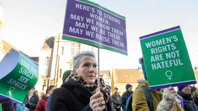 Supporters of the For Women Scotland and the Scottish Feminist Network demonstrate outside the Scottish Parliament