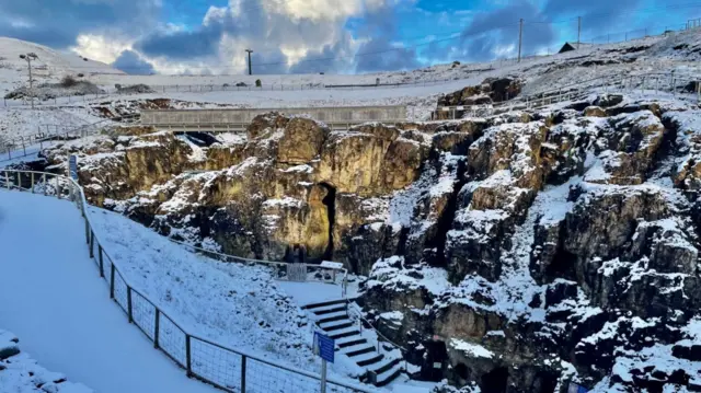 Snow covering rock