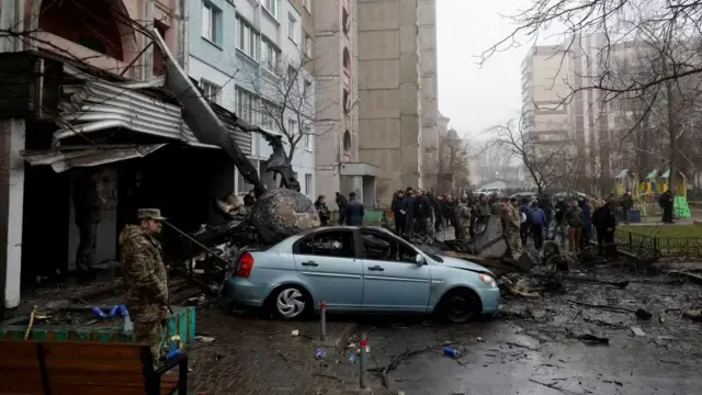 The remains of the helicopter were visible outside a residential building in Brovary