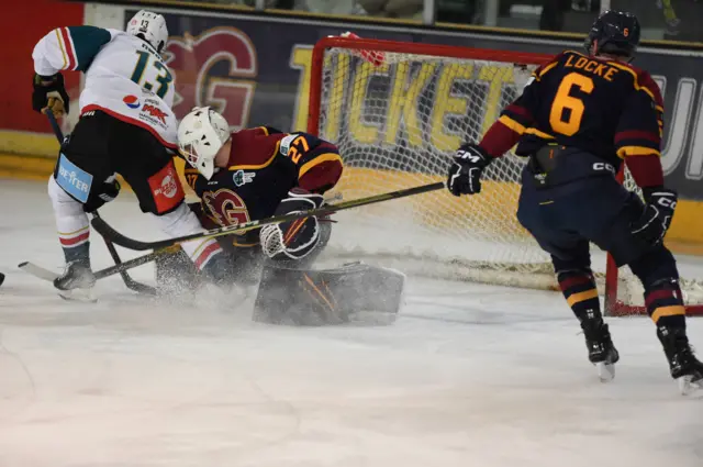 Giants Steve Owre denied by Flames goalie Eamon McAdam