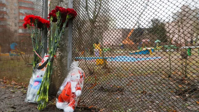 Flowers and toys left at the site of a helicopter crash in Brovary