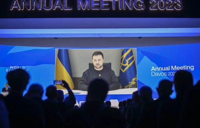 Ukrainian President Volodymyr Zelensky delivers a speech by video conference in Davos, Switzerland