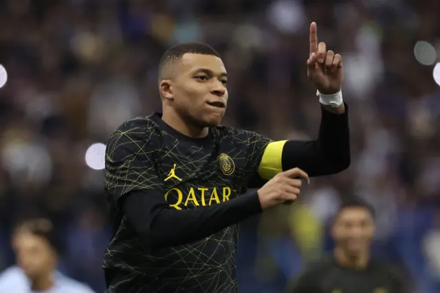 Kylian Mbappe sends Mohamed Al Owais the wrong way as he scores his penalty giving PSG the lead