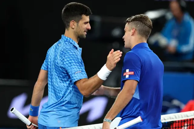 Novak Djokovic and Enzo Couacaud