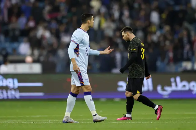 Is this the last time we see Messi and Ronaldo on a pitch together? - image on Messi walking past Ronaldo