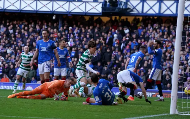 Celtic's Kyogo Furuhashi runs to grab the ball after scoring their side's second goal of the game during the cinch Premiership match at Ibrox Stadium