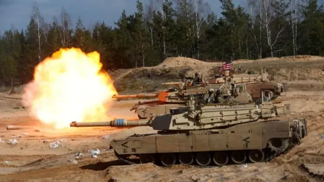 US Army M1 Abrams tanks firing during a Nato exercise