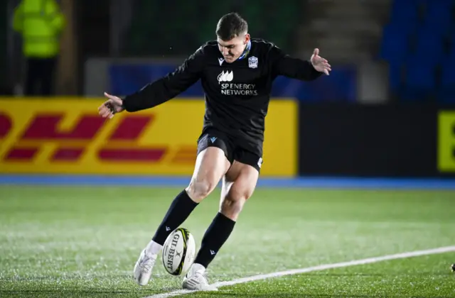 Tom Jordan kicks during the Glasgow warm-up