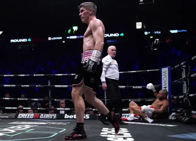 Liam Smith reacts after knocking Chris Eubank Jr down