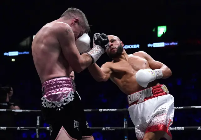 Chris Eubank Jr throws a punch at Liam Smith