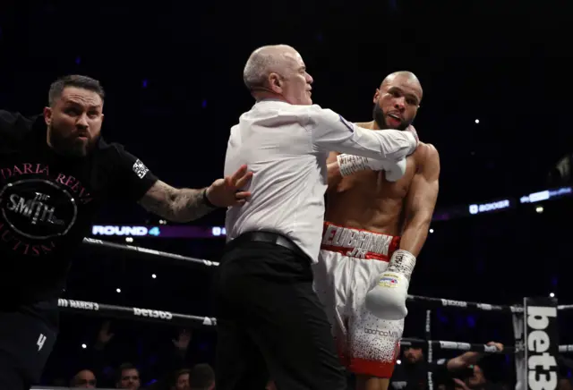 Referee Victor Loughlin stops the fight after Chris Eubank Jr was knocked down by Liam Smith