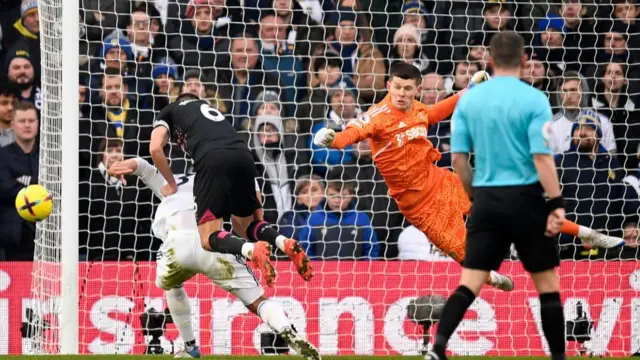 Illan Meslier saves the ball.