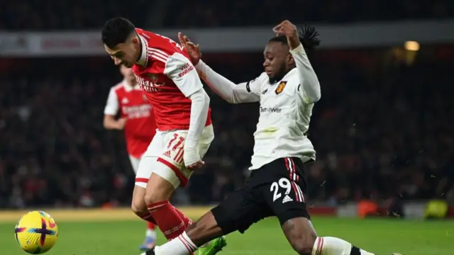 Gabriel Martinelli and  Aaron Wan-Bissaka during the game.