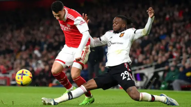 Aaron Wan-Bissaka tackling Gabriel Martinell