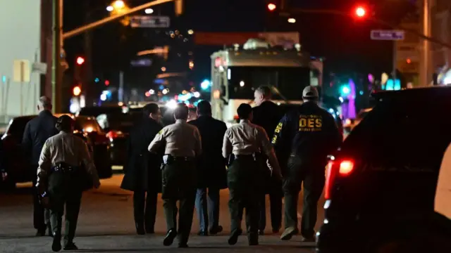 Investigators from the Los Angeles County Sheriff's Department Homicide bureau at the scene