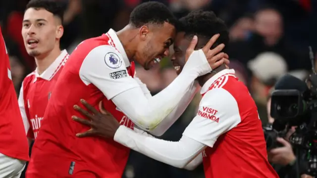 Bukayo Saka and Gabriel celebrating Saka's goal.