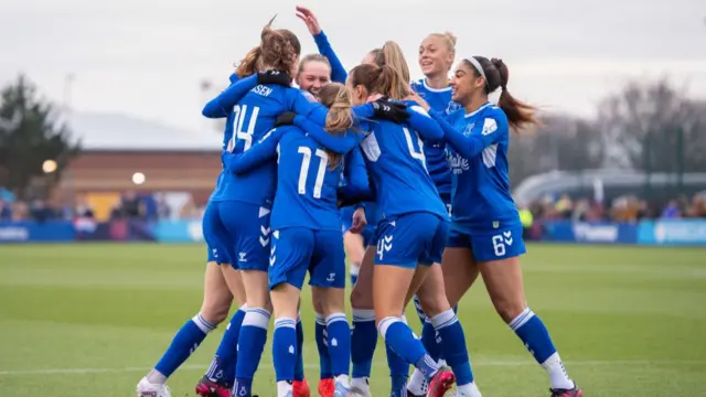 Everton players celebrate a goal