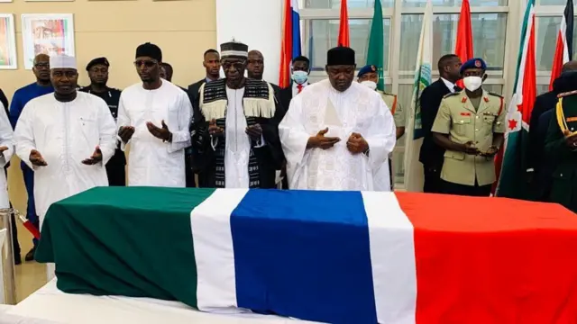 President Barrow by a coffin