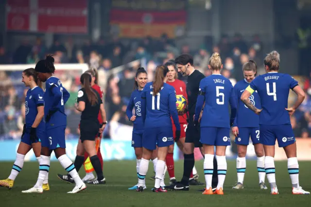 Referee Neil Hair walks off the pitch after abandoning the game