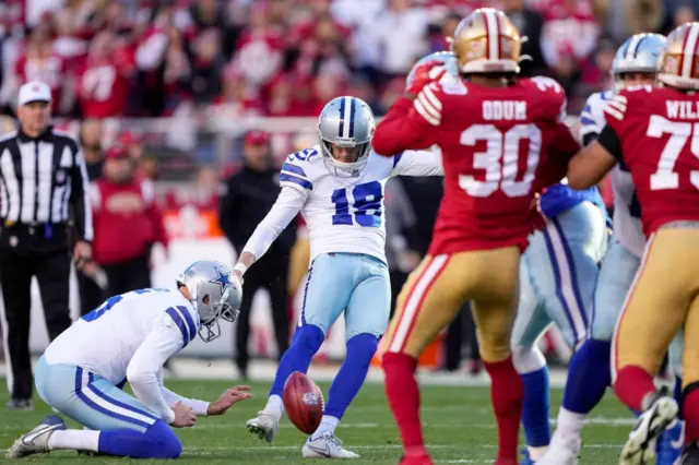 Brett Maher attempts a field goal