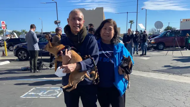 Alfonso and Jovita Matematico and their dogs, Peanut and Coco