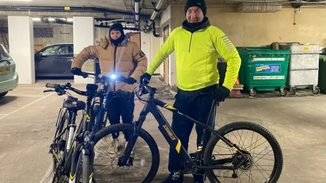 Amanda's husband and son setting off on their bikes