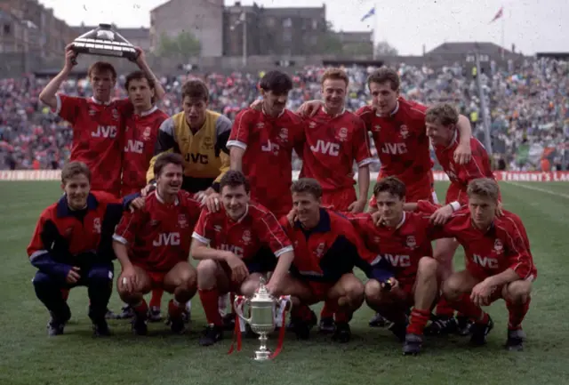 Aberdeen players celebrate after an epic 9-8 penalty shootout win over Celtic at Hampden