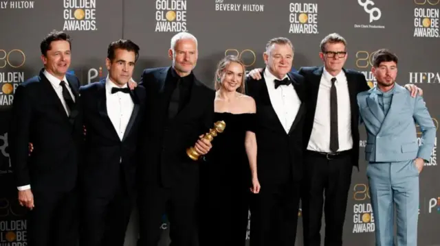 Peter Czernin, Colin Farrell, Martin McDonagh, Kerry Condon, Brendan Gleeson, Graham Broadbent, and Barry Keogha pose with the award for Best Picture