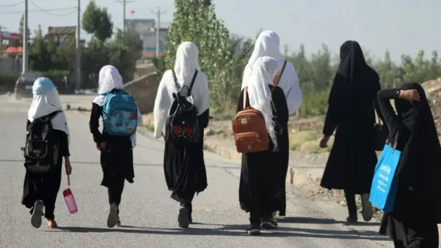 Girls walk to their school along a road in Gardez, Paktia province, on September 8, 2022.