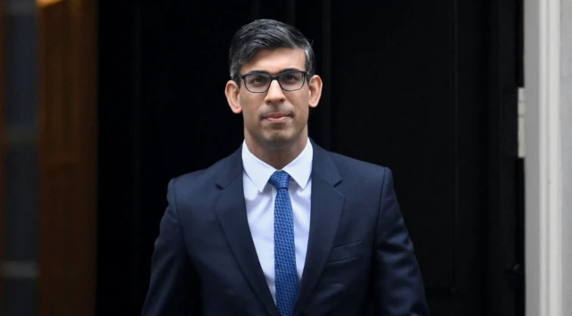 British Prime Minister Rishi Sunak looks on outside Number 10 Downing Street, in London